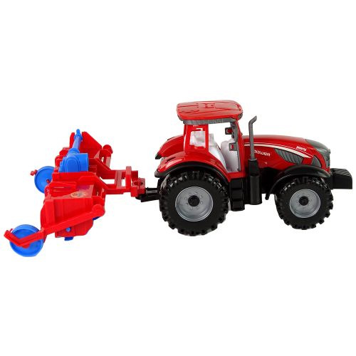 Crveni traktor s plugom slika 6