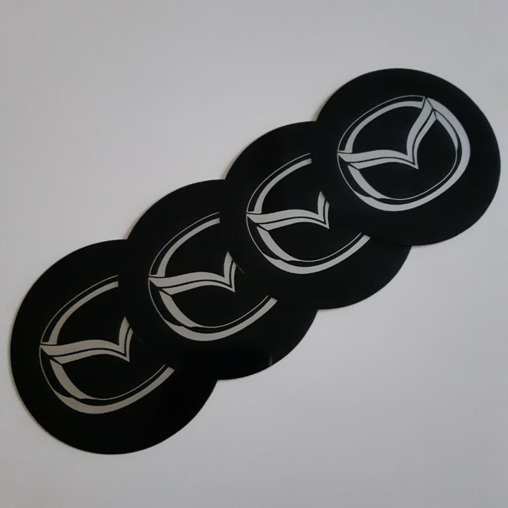 AMBLEMI ZA RATKAPE MAZDA FI76mm (SET 4 KOMADA) slika 1